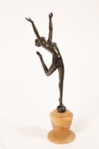 An Art Deco style bronzed metal figure, The Dancer, on an onyx base, 43.