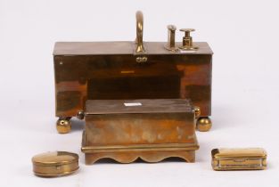 A penny operated tobacco box, 24cm wide, another and two small brass snuff boxes,