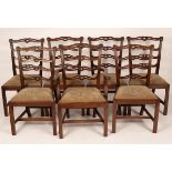 Six pierced and carved mahogany ladder back dining chairs,