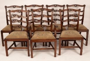 Six pierced and carved mahogany ladder back dining chairs,