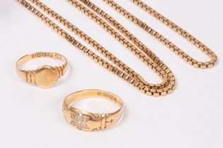 An 18ct gold diamond flower inset ring, an 18ct gold chain necklace and an 18ct gold signet ring,