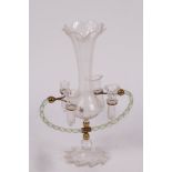 An English glass epergne, the central vase with flared rim,
