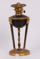 An Empire style oil lamp, japanned and gilt metal,