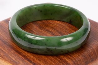 A jade bangle, 63mm inner diameter, approximately 81.