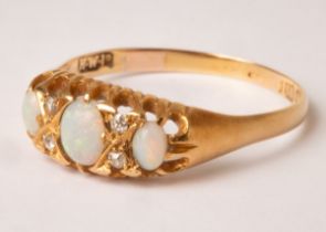An Edwardian opal and diamond ring, HWLd, circa 1905,