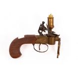 A flintlock taper lighter with engraved plates and candle to the side,