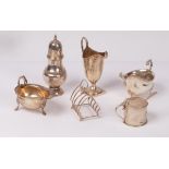 A group of table silver comprising cream jug, Nathan & Hayes, Chester 1908, a sugar caster,