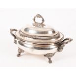 An old Sheffield plate soup tureen and cover, the domed cover with wreath handle,