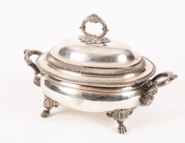 An old Sheffield plate soup tureen and cover, the domed cover with wreath handle,