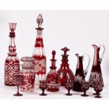 Two tall ruby overlay/stained glass bottle decanters and stoppers,