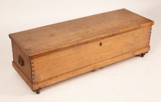 A pine two-handled chest, with casters,