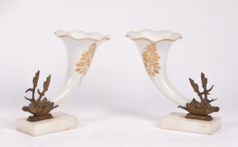 A pair of white glass frill-rimmed cornucopia with gilt metal stag-head terminals,