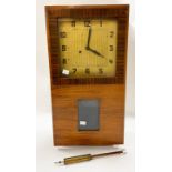 A 1930s walnut wall clock, fitted a thirty-hour striking movement,