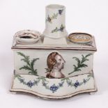 A Faience desk stand, circa 1800, rectangular with sand and inkpots,