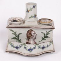 A Faience desk stand, circa 1800, rectangular with sand and inkpots,