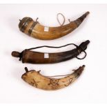 An Eastern powder horn with metal mounts and engraved brass cover, 22cm long,