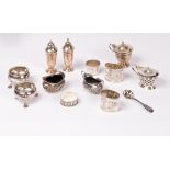 Various silver salts, napkin rings, one silver coloured napkin ring and cruets,