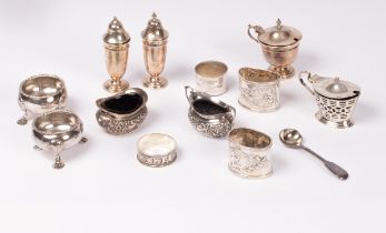 Various silver salts, napkin rings, one silver coloured napkin ring and cruets,