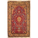 A Turkish prayer rug, the strawberry red field of birds and animals centred by a peach medallion,