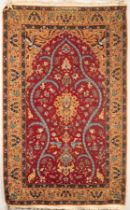 A Turkish prayer rug, the strawberry red field of birds and animals centred by a peach medallion,