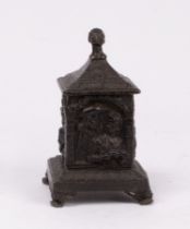 A Dutch lead tobacco jar, head finial, square shape with figures in relied,