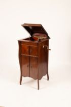 A mahogany cased gramophone, with lift-up top and two cupboard base on splay feet,