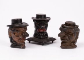 Three Mr Punch tobacco jars, one lead,