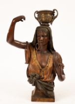 A bronzed torso of an Egyptian dancer, with headdress,