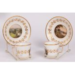 A pair of Derby topographical coffee cups and saucers, each painted with a titled local scene,