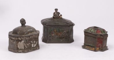 Three Georgian lead tobacco jars, two with figural finials, all with traces of green and red paint,