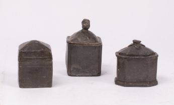Three Georgian lead tobacco boxes of plain form, one with head final, the tallest 14.