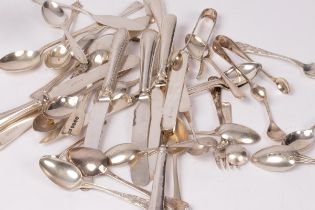 A large quantity of silver teaspoons, silver dessert knives etc.
