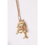 A 9ct gold dolphin pendant on chain, approximately 2.