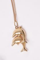 A 9ct gold dolphin pendant on chain, approximately 2.