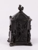 A lead tobacco jar, with cockerel finial, square canted shape,