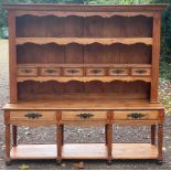 A large French dresser, 20th Century, with shelves and drawers above, three drawers and under-tier,