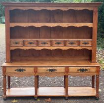 A large French dresser, 20th Century, with shelves and drawers above, three drawers and under-tier,