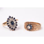 A diamond and sapphire cluster ring, lozenge shaped and set in 18ct yellow gold,