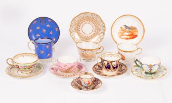 A group of eight 19th Century English porcelain cups and saucers,