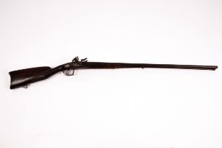 A double-barrel flintlock muzzle loading shotgun with shaped trigger guard,