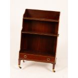 A Regency mahogany waterfall front open bookcase, boxwood strung and fitted a drawer to the base,