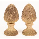 A pair of reconstituted stone pineapple gate post finials,