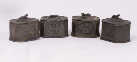 Four Georgian lead tobacco jars, all with dog finials and interior scenes in relief,