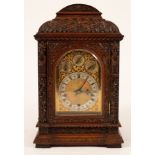 A late 19th Century carved walnut eight-day bracket clock,