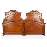 A pair of 18th Century Italian style single beds,