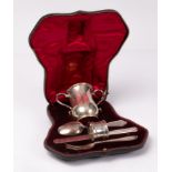 An Edwardian silver cased Christening set, Goldsmiths & Silversmiths Co. Ltd.