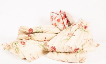Two pairs of lined floral curtains,