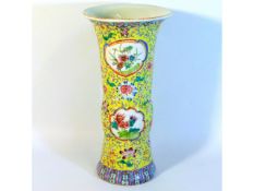 An antique trumpet shaped Chinese vase, six charac