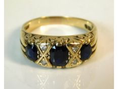 A 9ct gold ring set with diamond & sapphire, 4.1g, size M/N