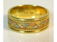 A three colour 18ct gold band, signed RP, 5.5g, size K/L